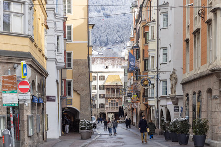Innsbruck, Tyrol, Austria - February 26, 2023: View of Herzog-Friedrich street on Old Town with Goldenes Dachl (Golden Roof), decorative balcony on imperial building built in 1500のeditorial素材
