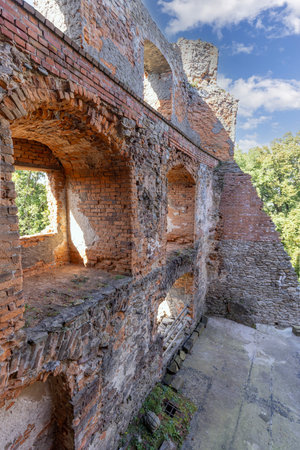 Zagorze Slaskie, Grodno, Poland - October 1, 2021: Medieval Grodno Castle, ruins of red brick wall with arched window openingsのeditorial素材