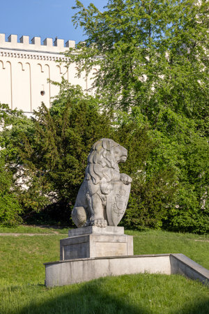 Lublin, Poland - May 23, 2022: Lublin Castle, neo-gothic facade and stone statue of lion.The figure of lion was recreated according to the pattern from the Cemetery of the Defenders in Lvivのeditorial素材