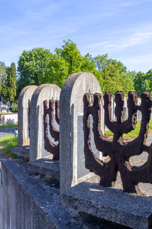 Lublin, Poland - May 24, 2022: New Jewish cemetery, decorative fence in the shape of a Jewish menorahのeditorial素材
