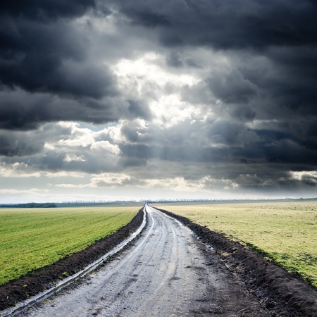 dirty road to cloudy horizon. rain before dirty road to cloudy horizon. rain before