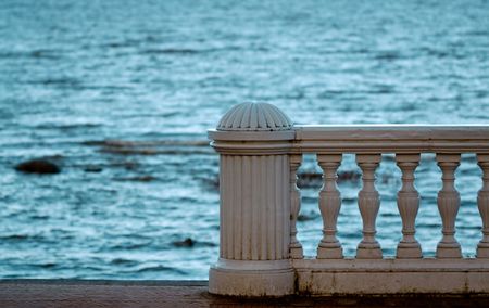 The sea-front with railing in autumn.の写真素材