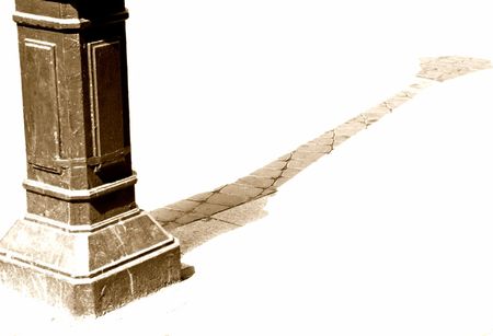 The shadow of old street-lamp on pavement.の写真素材