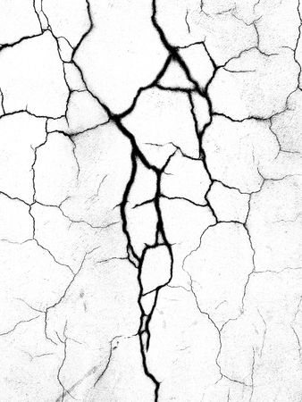 The crack on the wall close-up. Black and white.の写真素材