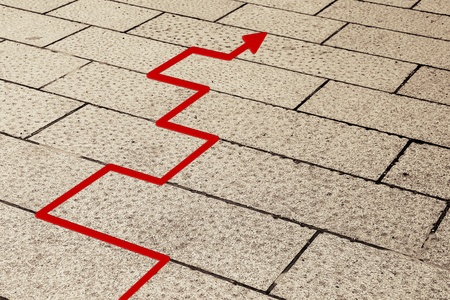 Red arrow on a pavement.の写真素材