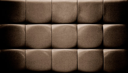 The leather upholstery background close up.