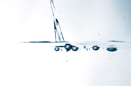 The water stream in a glass.