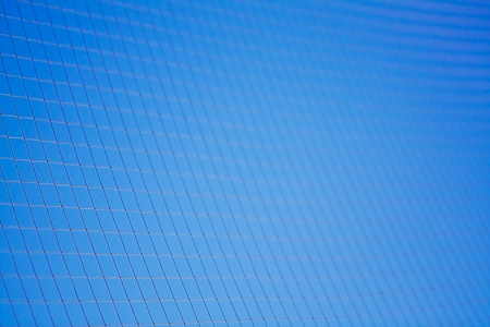The fragment of kapron net against blue sky.の写真素材