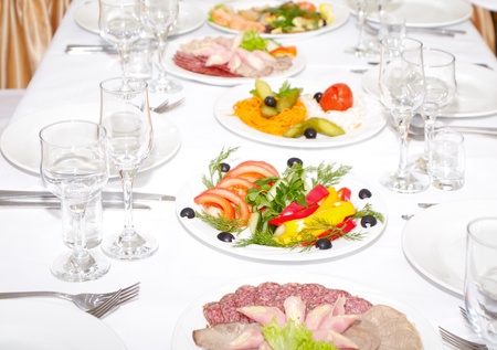 The served dinner table in a restaurant. の写真素材