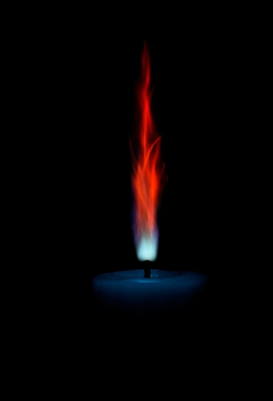 Lonely candle with unusual flame.の写真素材