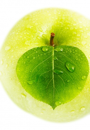 Green apple with a leaf.の写真素材