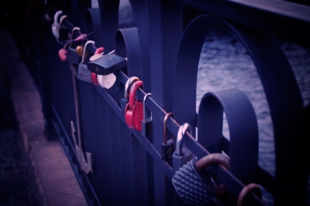 symbol of love - padlocks chained on a bridgeの写真素材