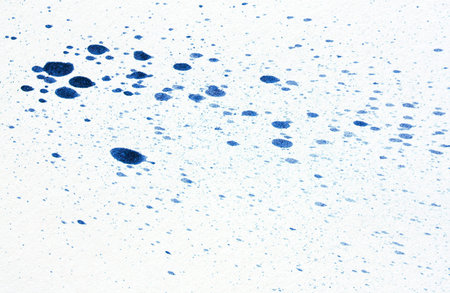 ink blot on a textured paperの写真素材