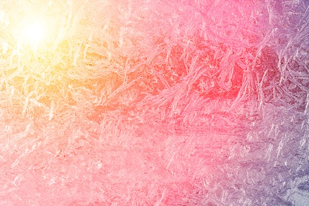 The white frost on windowpane on sunset の写真素材