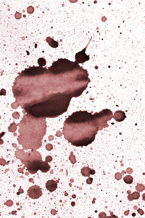 ink blot on a textured paperの写真素材