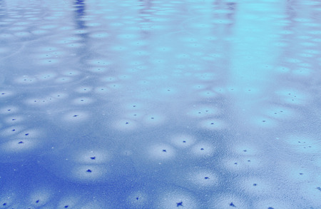 cracked ice on a lake in winterの写真素材