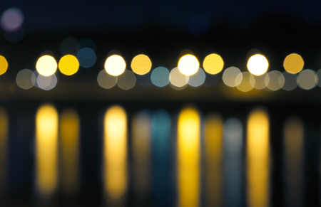 defocused street lamps and reflection on a water, natural photo imageの写真素材