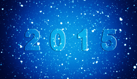 the christmas snowfall in the evening with inscription 2015の写真素材