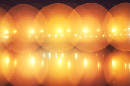 defocused street lamps and reflection on a water, natural photo imageの写真素材