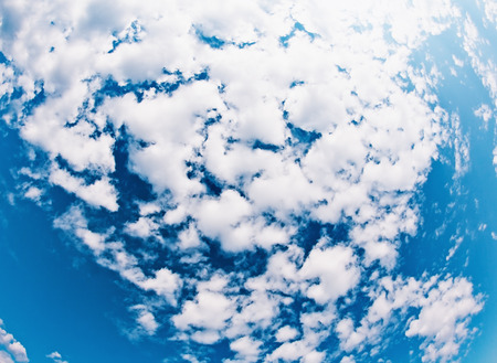 clouds on a sky in a clear day, wide angle viewの写真素材