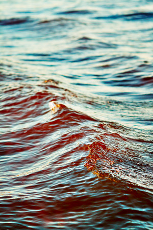 sea wave close up, low angle view, cross processing effectの写真素材