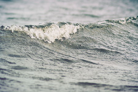 sea wave close up, low angle view, cross processing effectの写真素材