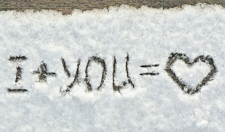 The love message. I and you mean love - written on snow.の写真素材