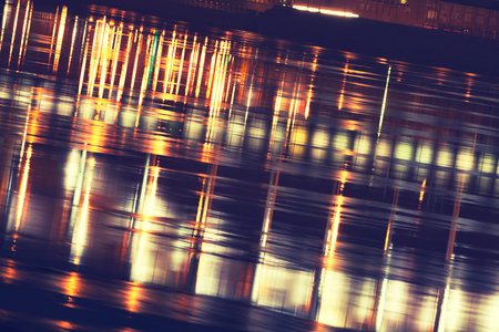 water surface of a town's river at night
