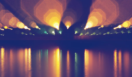 defocused street lamps and reflection on a water, natural photo imageの写真素材