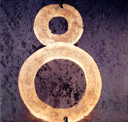 number 8 on an iron abstract backgroundの写真素材