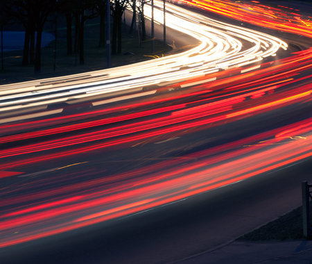 abstract image of blur motion of cars on the city road at nightの写真素材