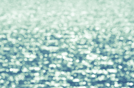 water surface in summer, abstract blurred background, sunny bokehの写真素材
