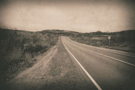 travel concept, scandinavian empty country road, old vintage photoの写真素材