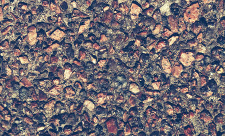 wall background from small stones, vintage colorsの写真素材