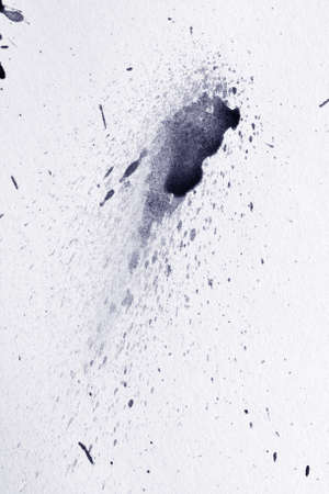 ink blot on a textured paperの写真素材