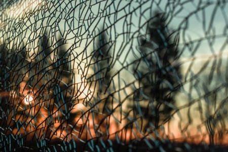 ecology concept - broken dirty glass outdoor, forest on backgroundの写真素材