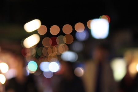 Colourful defocused lights on darkの写真素材