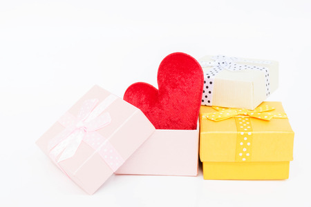Red heart  shape in the gift box on white backgrounの写真素材