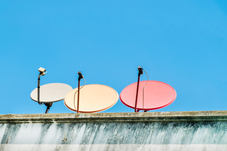 Satellite Dishes on apartment for telecommunicationの写真素材