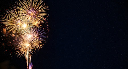 Bright fireworks against dark sky festive night celebrationの素材