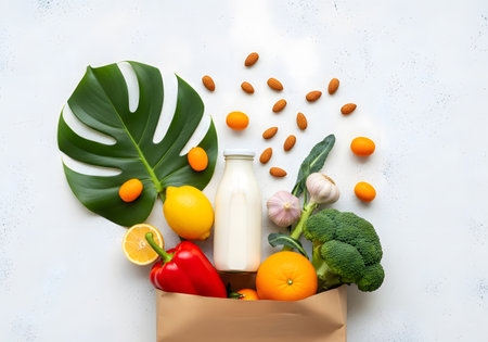 Fresh fruits and vegetables in reusable shopping bag promoting eco friendly lifestyle and clean eatingの素材