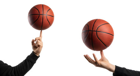 A pair of images showing hands performing basketball tricks: spinning the ball on a finger and balancing it. Skill and control conceptの素材