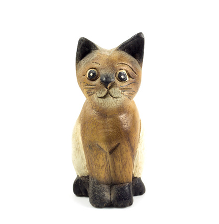 brown wood cat statue isolated on white backgroundの写真素材