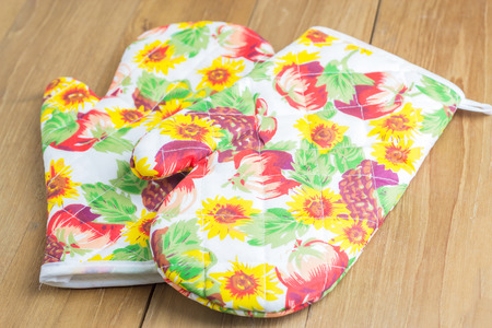 oven glove on wooden boardの写真素材