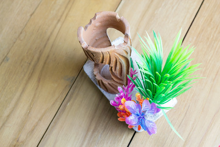 fake plastic coral on wooden boardの写真素材