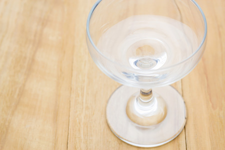 glass cup on wooden boardの写真素材