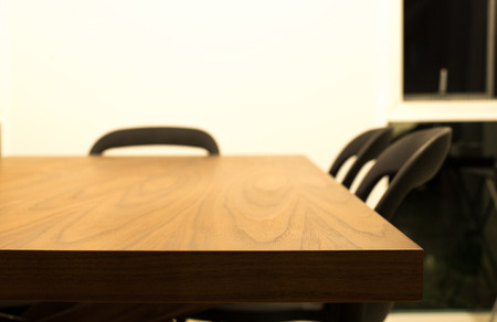 Dark brown wooden dining table with 3 chairsの写真素材