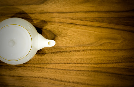 Tea pot on Wooden tableの写真素材