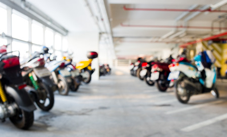 Blur background urban indoor motorcycle parkingの写真素材