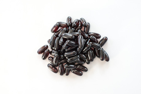 Grape seeds vitamins isolated on the white backgroundの写真素材